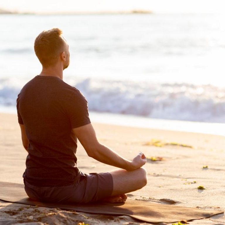 back-view-man-relaxing-beach-outside