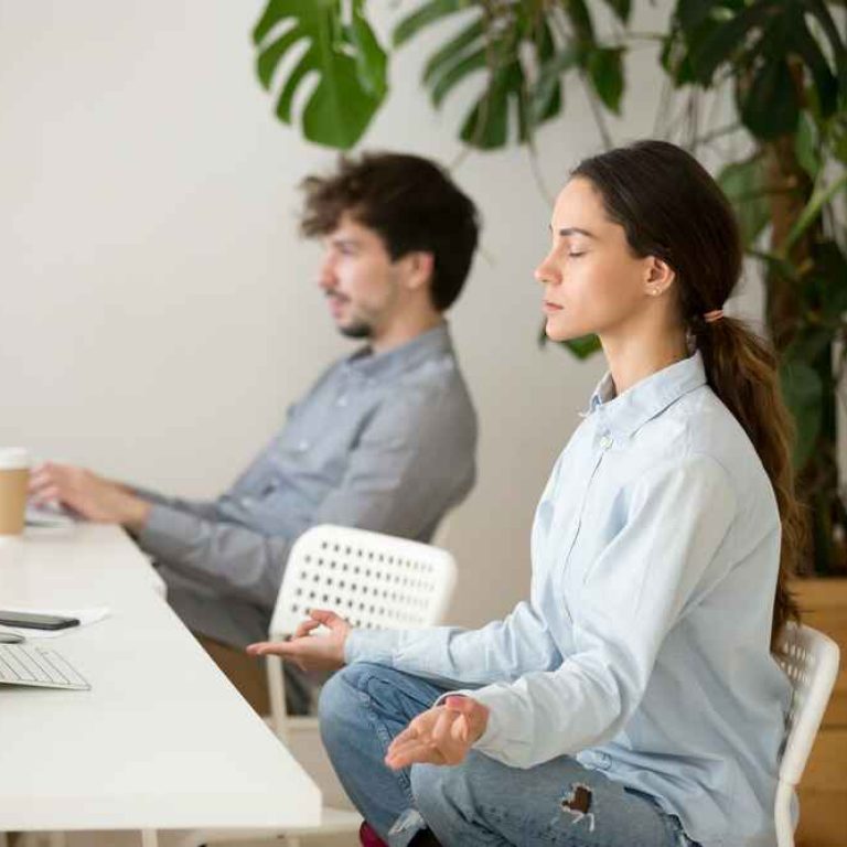 mindful-calm-young-woman-taking-break-office-meditation-1